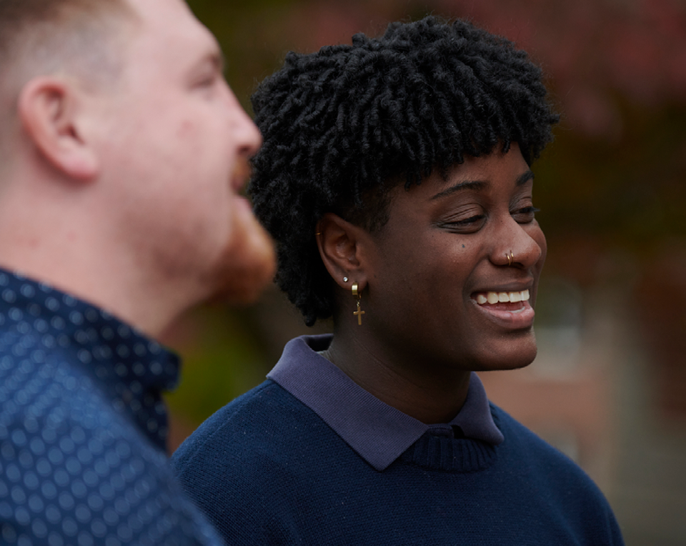 A picture of two people smiling.